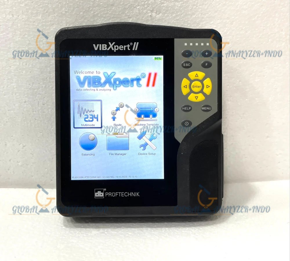 Technician using VIBXPERT II vibration analyzer for machine inspection