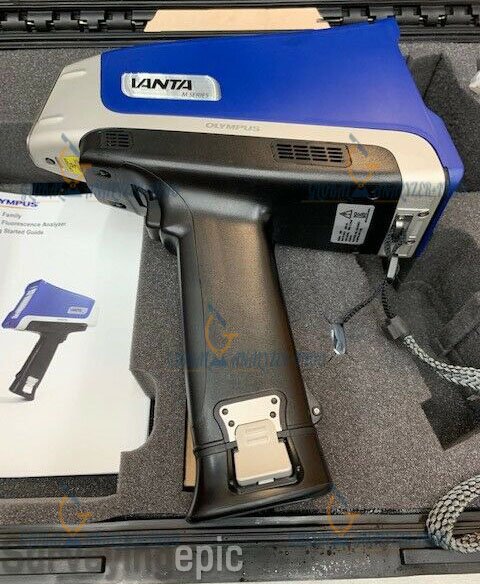 Vanta M Series handheld XRF analyzer kit with batteries, charger, and carrying case